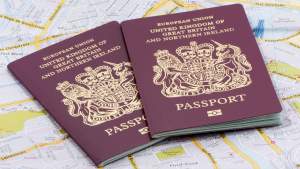 Two passports lying on a map