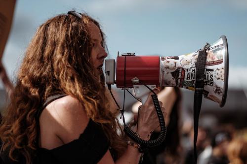 Woman using her right to protest - photo by Clem Onojeghuo via Unsplash